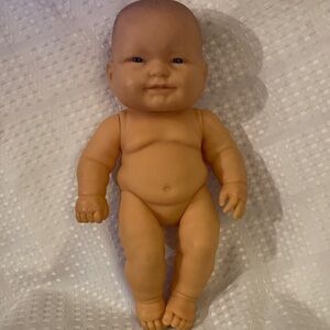 Berenguer baby doll, blue eyes and 2 front teeth, 13 inches tall.